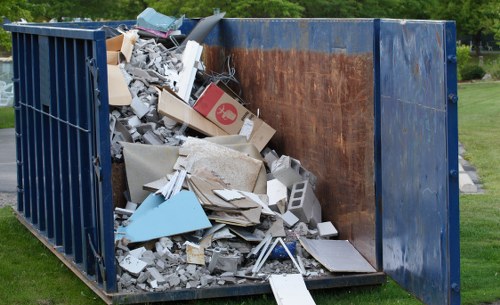 Residential street in Fitzrovia with a skip container