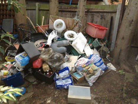 Residential renovation with a skip in the background